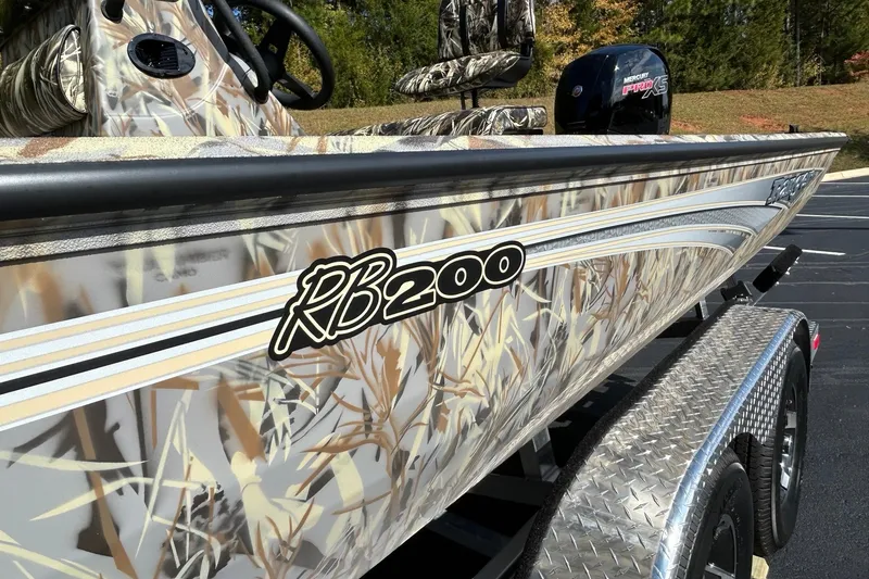 Slide: The Image of 2027 Ranger RB200 boat with camouflage design on a trailer. - 8