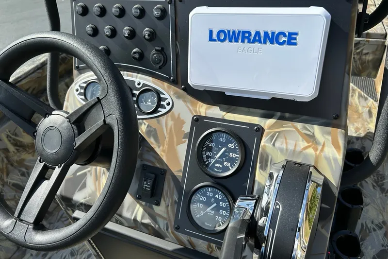 Slide: The Image of Steering wheel and dashboard of 2027 Ranger RB200 boat with Lowrance Eagle display. - 11