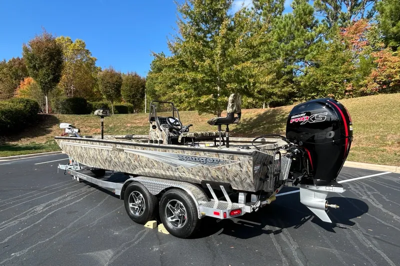 Slide: The Image of 2027 Ranger RB200 boat with camouflage design on a trailer, parked outdoors. - 5