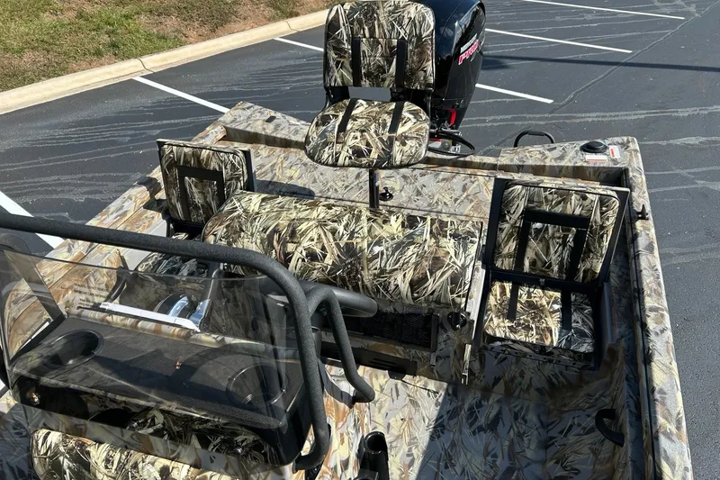 Slide: The Image of 2027 Ranger RB200 boat with camouflage seats and console, parked in a lot. - 10