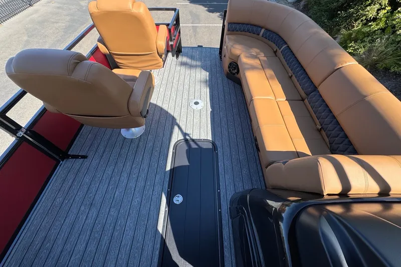 Slide: The Image of Interior of 2027 Ranger 223FC boat with tan seating and gray flooring. - 13