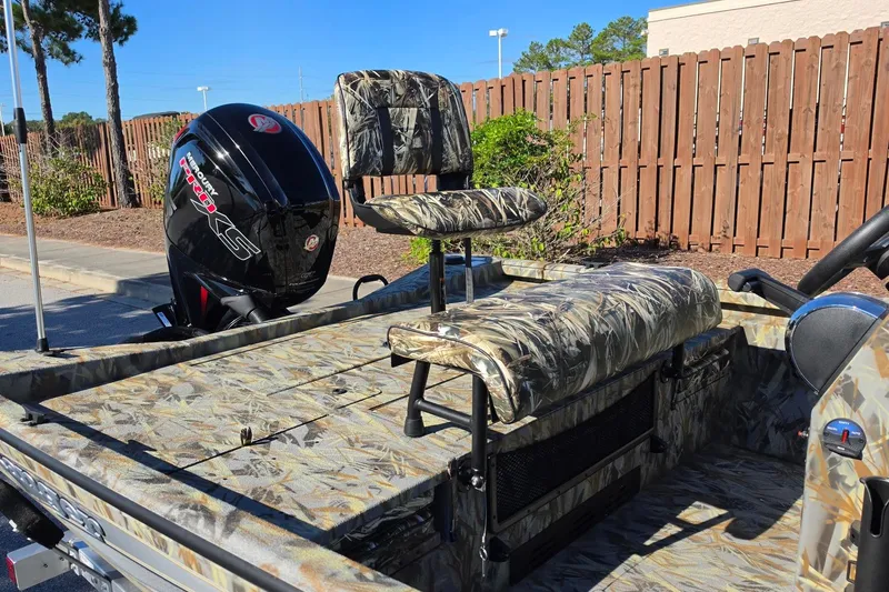 Slide: The Image of 2027 Ranger RB190 boat with camo seats and powerful outboard motor. - 16