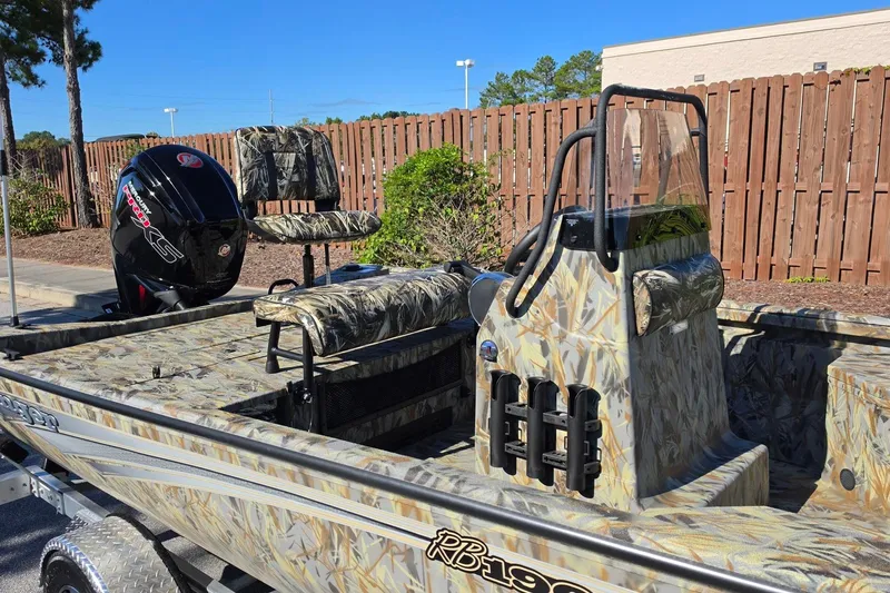 Slide: The Image of 2027 Ranger RB190 boat with camouflage design, featuring a powerful outboard motor. - 17