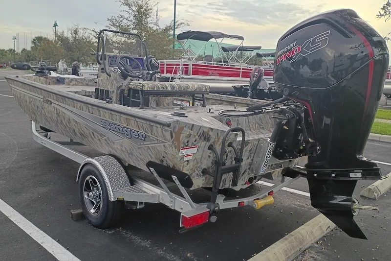 Slide: The Image of 2027 Ranger RB190 boat with camo design and Mercury Pro XS engine on trailer. - 3