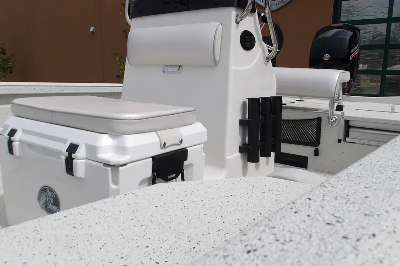 Slide: The Image of 2027 Ranger RB200 boat interior with seating and storage, featuring a Bass Pro Shops cooler. - 15