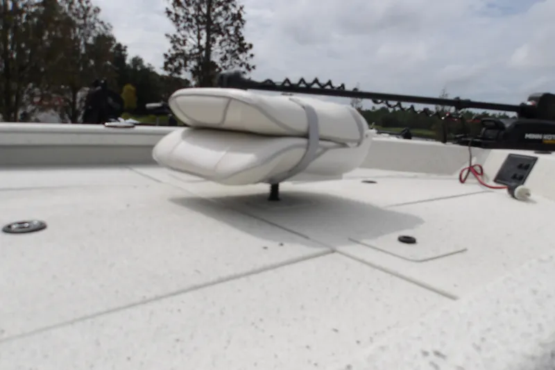 Slide: The Image of 2027 Ranger RB200 boat deck with folded white seat and fishing equipment. - 10