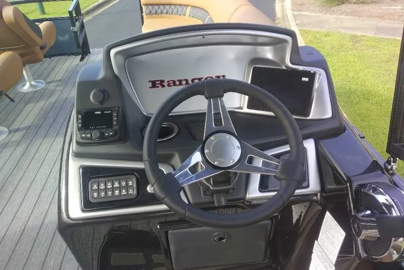 Slide: The Image of Steering console of 2027 Ranger 220FC boat with modern controls and dashboard. - 2