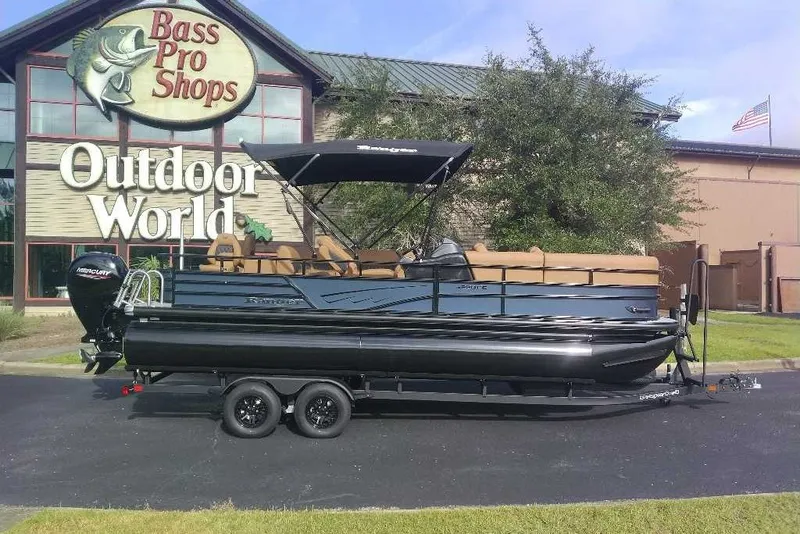 Slide: The Image of 2027 Ranger 220FC pontoon boat parked outside Bass Pro Shops Outdoor World. - 1