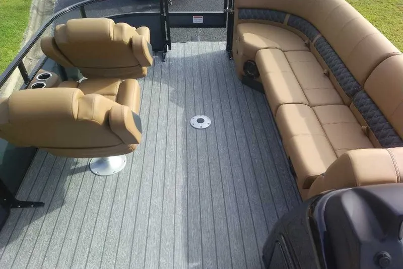 Slide: The Image of Interior of 2027 Ranger 220FC boat with tan seating and gray flooring. - 10