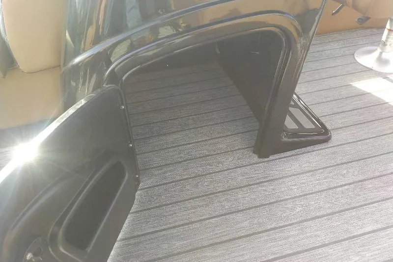 Slide: The Image of Interior view of a 2027 Ranger 220FC boat with sleek seating and flooring. - 7