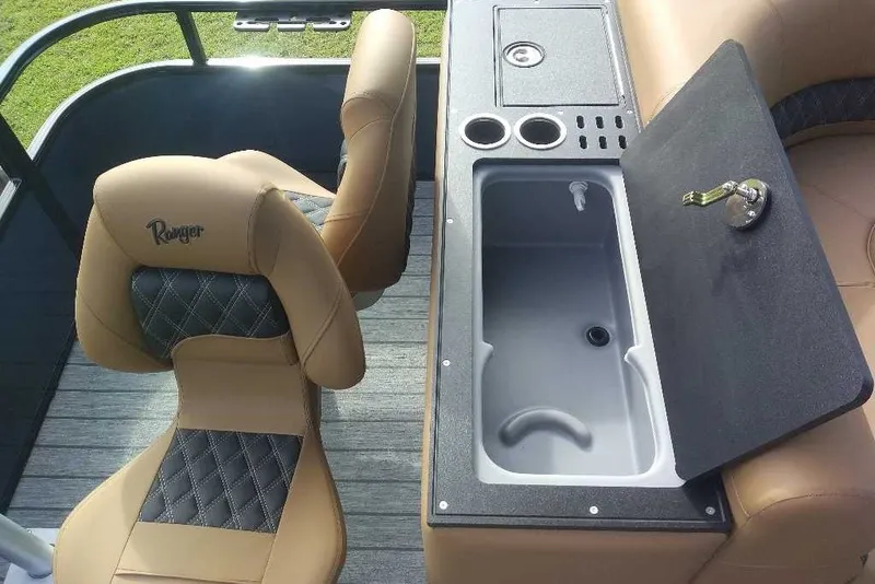 Slide: The Image of Luxurious interior of 2027 Ranger 220FC boat with tan seating and built-in sink. - 3