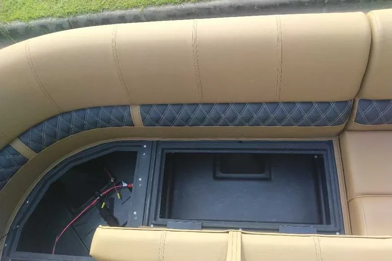 Slide: The Image of Luxurious seating on 2027 Ranger 220FC boat with storage compartment. - 9