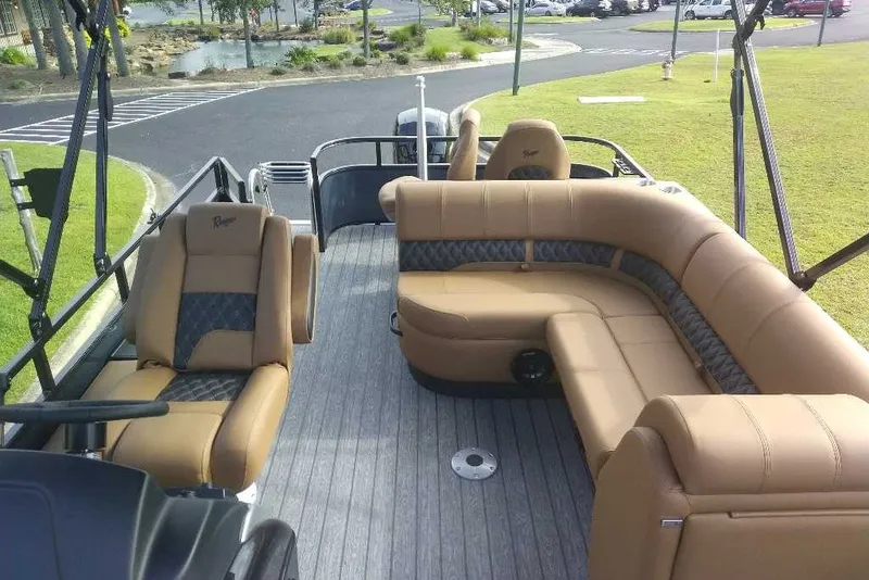 Slide: The Image of Luxurious interior of 2027 Ranger 220FC boat with tan seating and modern design. - 4