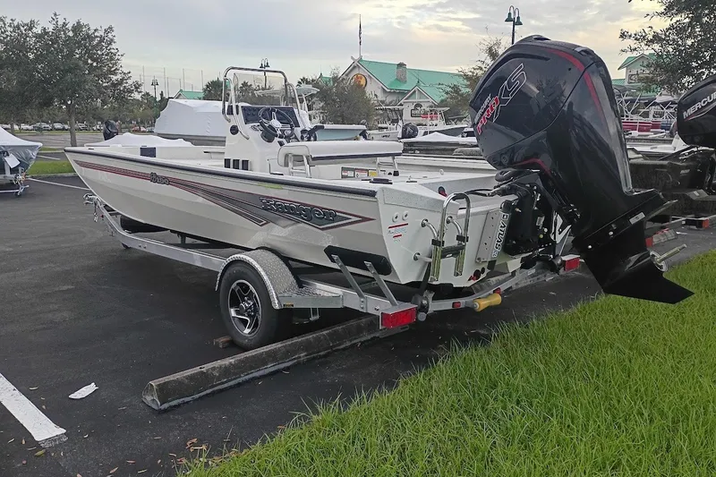 Slide: The Image of 2027 Ranger RB190 boat on trailer with powerful outboard motor in parking lot. - 3