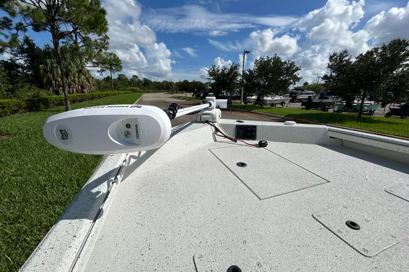 Slide: The Image of 2027 Ranger RB200 boat deck with Minn Kota Terrova trolling motor, under a clear blue sky. - 13