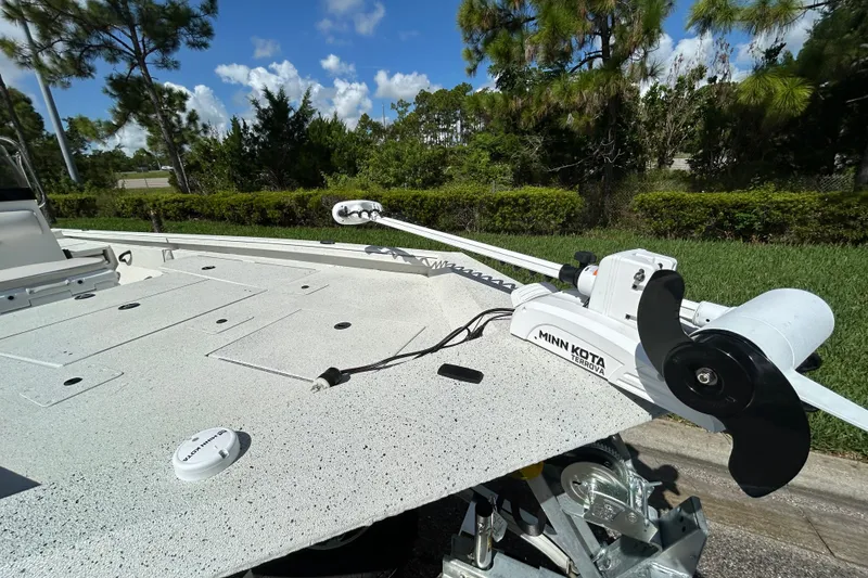Slide: The Image of Ranger RB200 2027 boat with Minn Kota Terrova trolling motor, parked outdoors. - 14