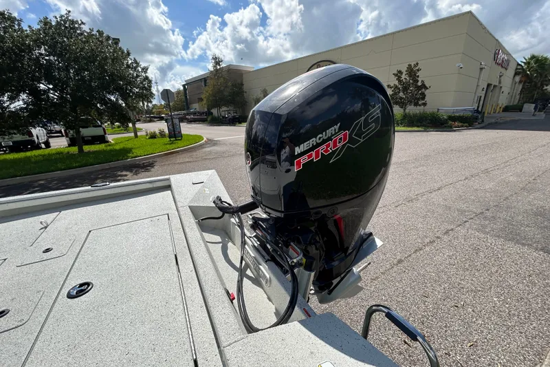 Slide: The Image of 2027 Ranger RB200 boat with Mercury Pro XS engine in a sunny outdoor setting. - 8