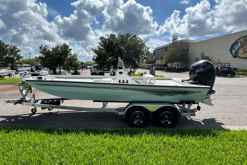 Slide: The Image of 2027 Ranger RB200 boat on trailer, parked outdoors under a partly cloudy sky. - 5