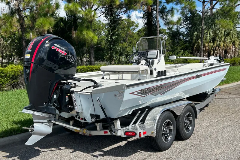 Slide: The Image of 2027 Ranger RB200 boat with Mercury Pro XS engine on a trailer, parked outdoors. - 7