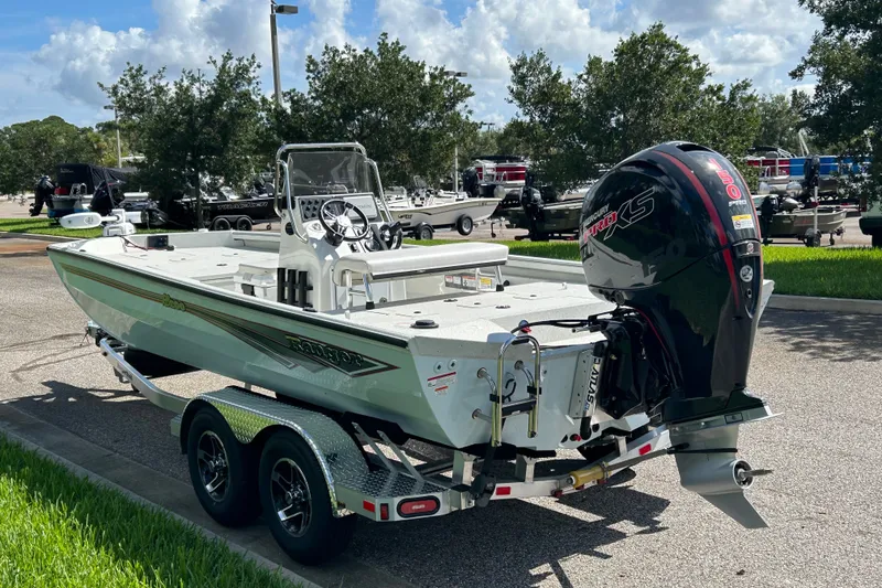 Slide: The Image of 2027 Ranger RB200 boat with Mercury Pro XS engine on a trailer, parked outdoors. - 6