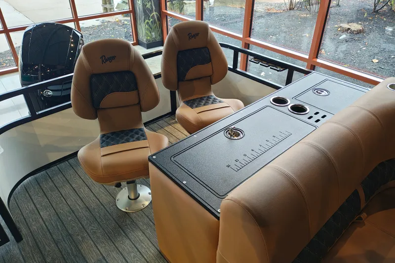 Slide: The Image of Luxurious interior of 2027 Ranger 220FC boat with plush seating and sleek design. - 45