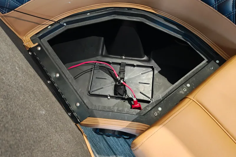 Slide: The Image of Storage compartment in 2027 Ranger 220FC boat with visible wiring and seating. - 12