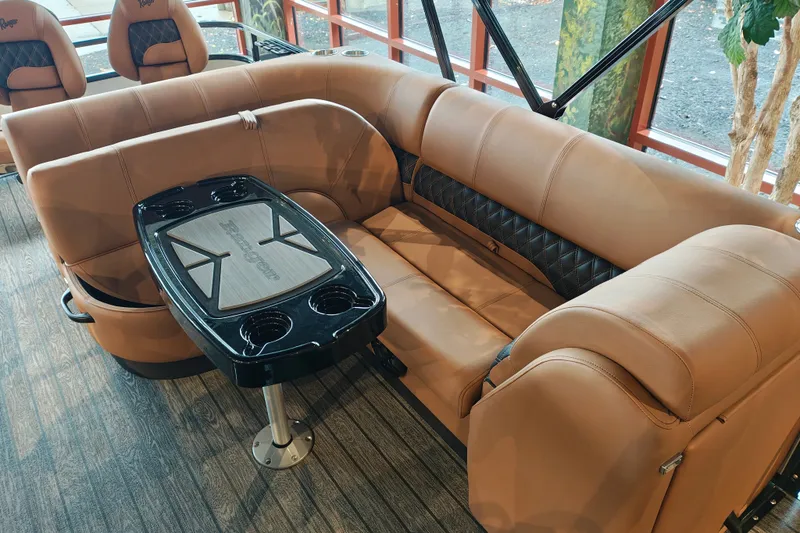 Slide: The Image of Luxurious seating area in 2027 Ranger 220FC boat with stylish table and cup holders. - 43