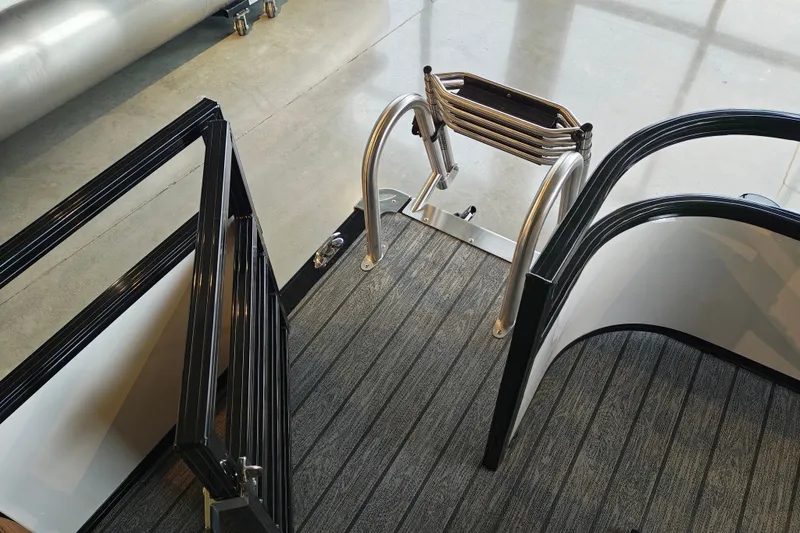Slide: The Image of Ranger 220FC 2027 boat deck with foldable ladder and sleek railing design. - 52