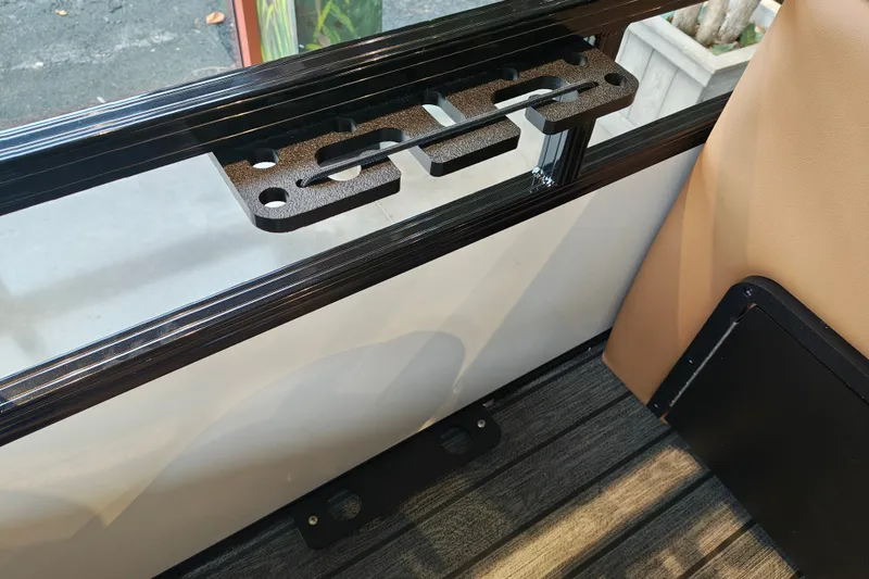 Slide: The Image of Interior view of a 2027 Ranger 220FC boat, featuring a mounted accessory bracket. - 50