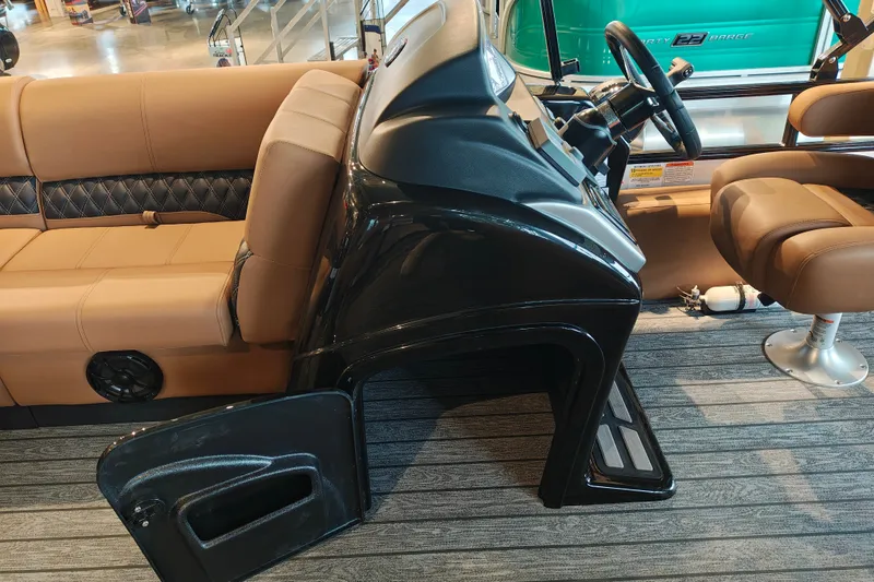 Slide: The Image of Interior of a 2027 Ranger 220FC boat with tan seating and steering console. - 19