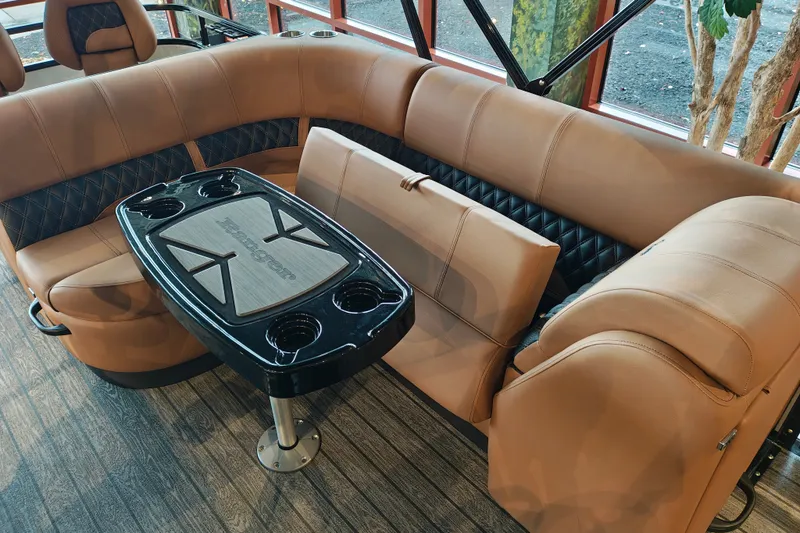 Slide: The Image of Luxurious seating area in 2027 Ranger 220FC boat with stylish table and cup holders. - 41
