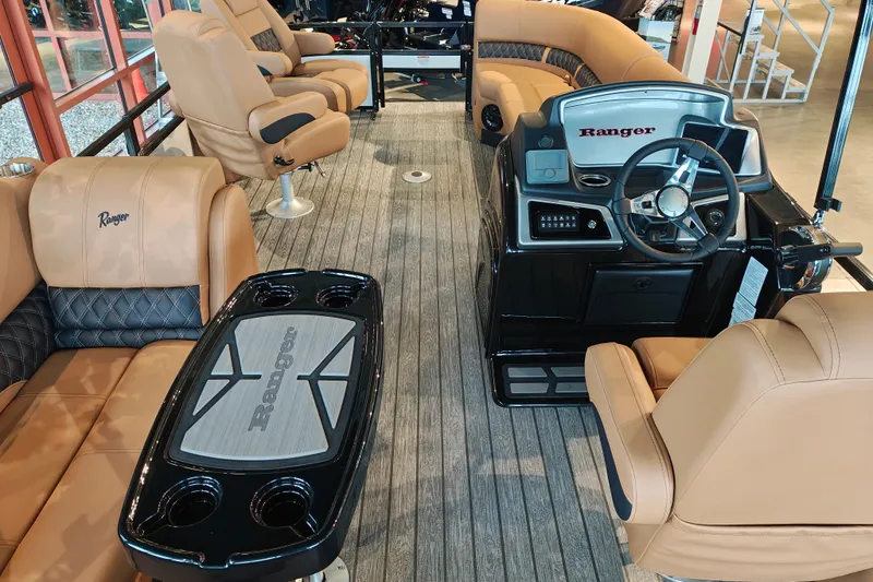 Slide: The Image of 2027 Ranger 220FC boat interior with luxurious seating and modern steering console. - 60