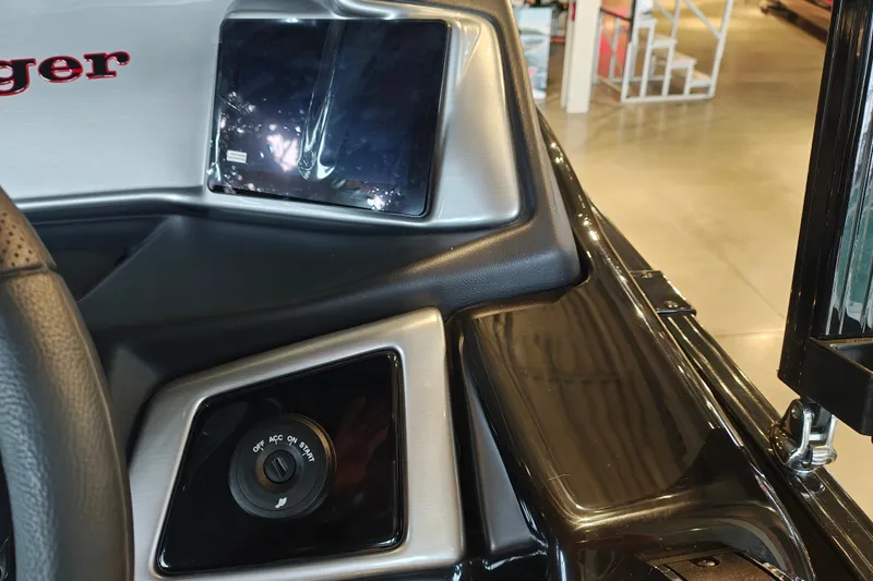 Slide: The Image of Dashboard of a 2027 Ranger 220FC boat with ignition switch and display screen. - 24