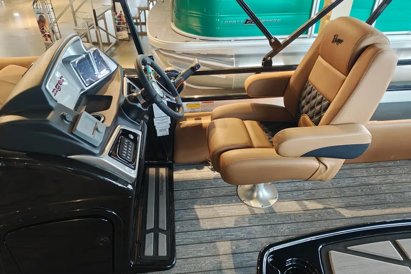 Slide: The Image of Captain's seat and helm of 2027 Ranger 220FC boat, featuring modern controls and luxurious seating. - 20