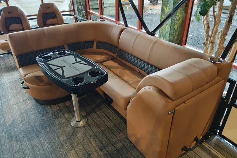 Slide: The Image of Luxurious seating area in a 2027 Ranger 220FC boat with elegant brown upholstery. - 40
