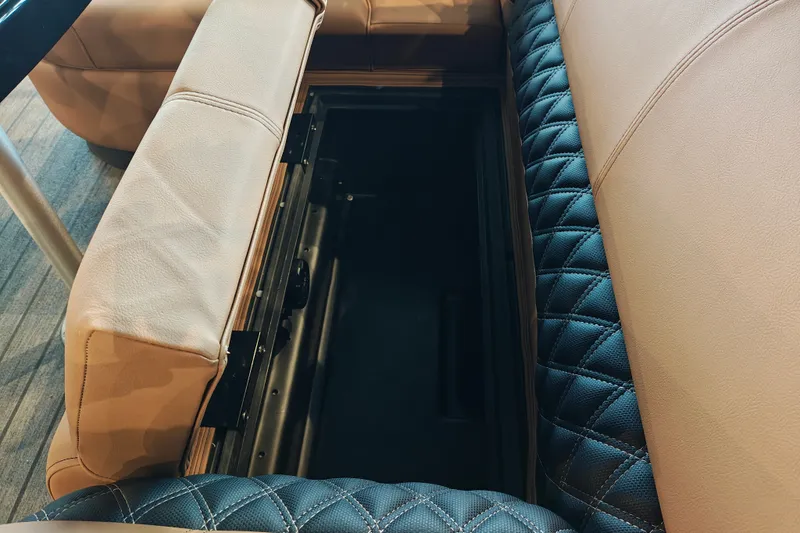 Slide: The Image of Interior storage compartment of 2027 Ranger 220FC with quilted leather seating. - 42
