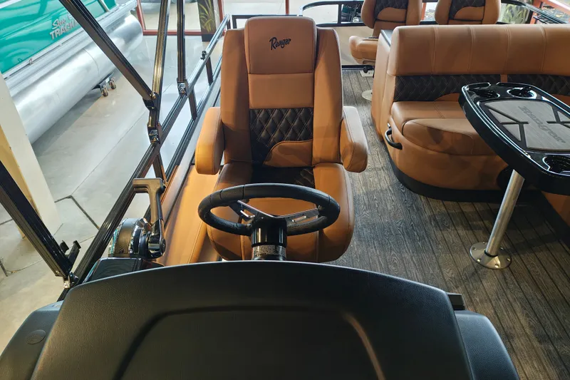 Slide: The Image of Luxurious interior of 2027 Ranger 220FC boat with leather seating and steering wheel. - 21