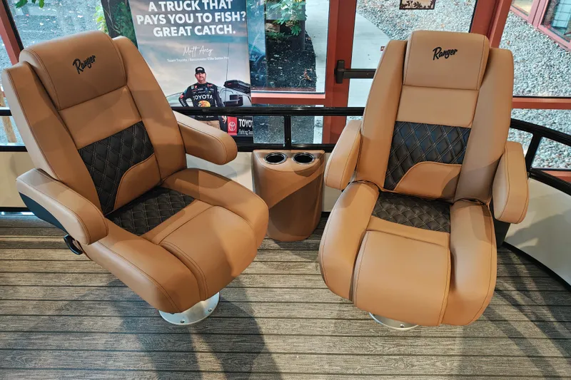 Slide: The Image of Luxurious Ranger 220FC 2027 boat seats with diamond-patterned upholstery and cup holders. - 35