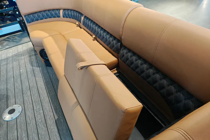 Slide: The Image of Luxurious seating on 2027 Ranger 220FC boat with tan and black upholstery. - 15