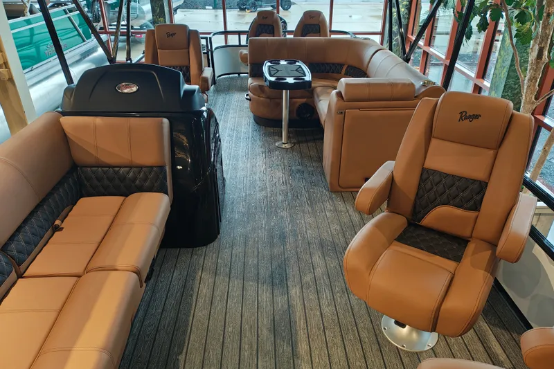 Slide: The Image of Luxurious interior of 2027 Ranger 220FC boat with plush seating and modern design. - 9