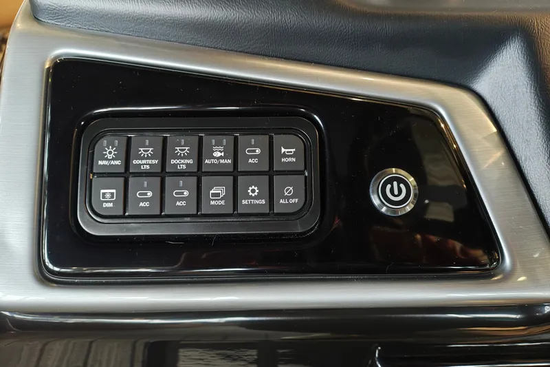 Slide: The Image of Control panel of 2027 Ranger 220FC with various function buttons and power switch. - 28