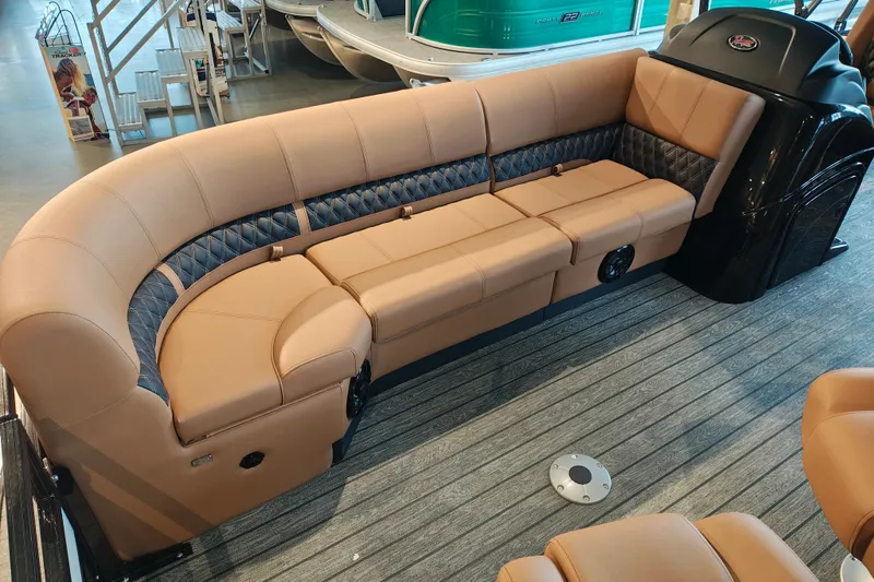 Slide: The Image of Luxurious seating on 2027 Ranger 220FC boat with tan upholstery and quilted accents. - 10
