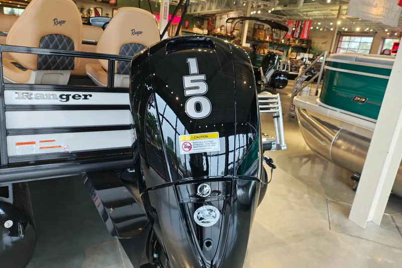 Slide: The Image of 2027 Ranger 220FC boat with a 150 horsepower engine displayed in a showroom. - 8