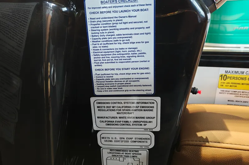 Slide: The Image of Boater's checklist and emissions information on a 2027 Ranger 220FC boat dashboard. - 32