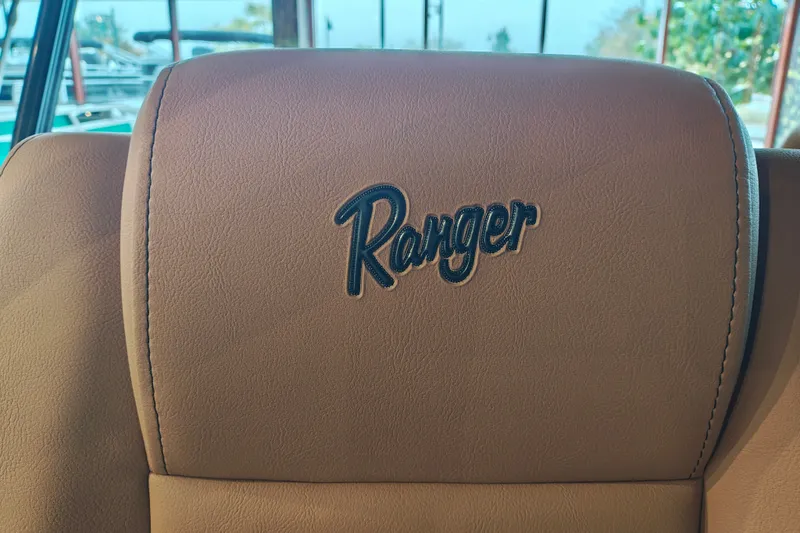 Slide: The Image of Brown leather seat with "Ranger" logo, 2027 Ranger 220FC model. - 22