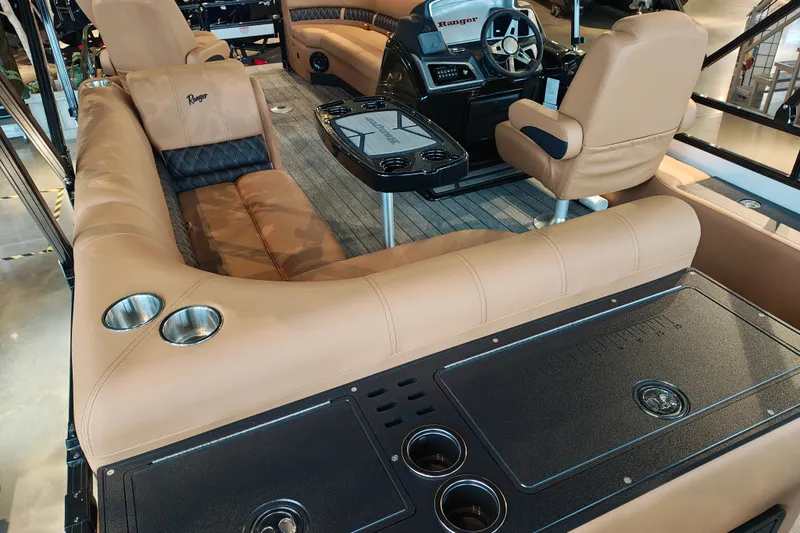 Slide: The Image of Luxurious interior of 2027 Ranger 220FC boat with tan seating and modern helm. - 59
