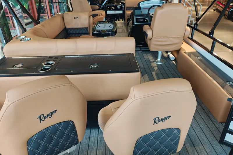 Slide: The Image of Luxurious interior of 2027 Ranger 220FC boat with tan leather seating and modern amenities. - 57