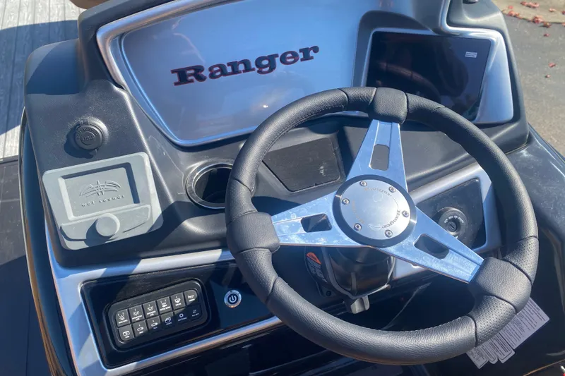 Slide: The Image of Steering console of 2027 Ranger 223F boat with modern controls and branding. - 14