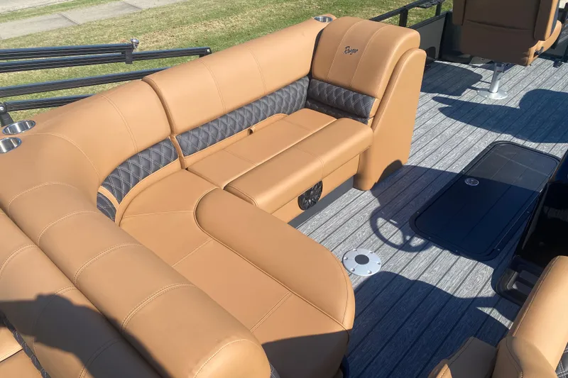 Slide: The Image of Luxurious seating on 2027 Ranger 223F boat with tan upholstery and cup holders. - 6
