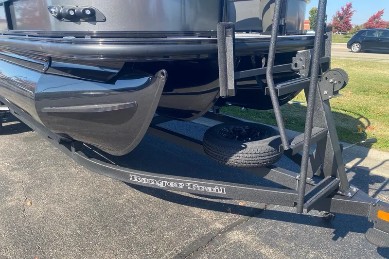 Slide: The Image of Ranger 223F boat on trailer, 2027 model, parked outdoors on a sunny day. - 5